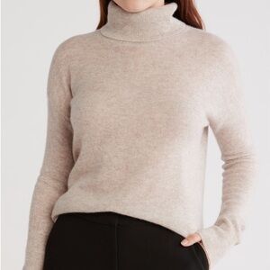 Beige Sweater and Black Pants